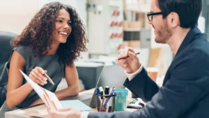 business woman sharing analytics with a business man