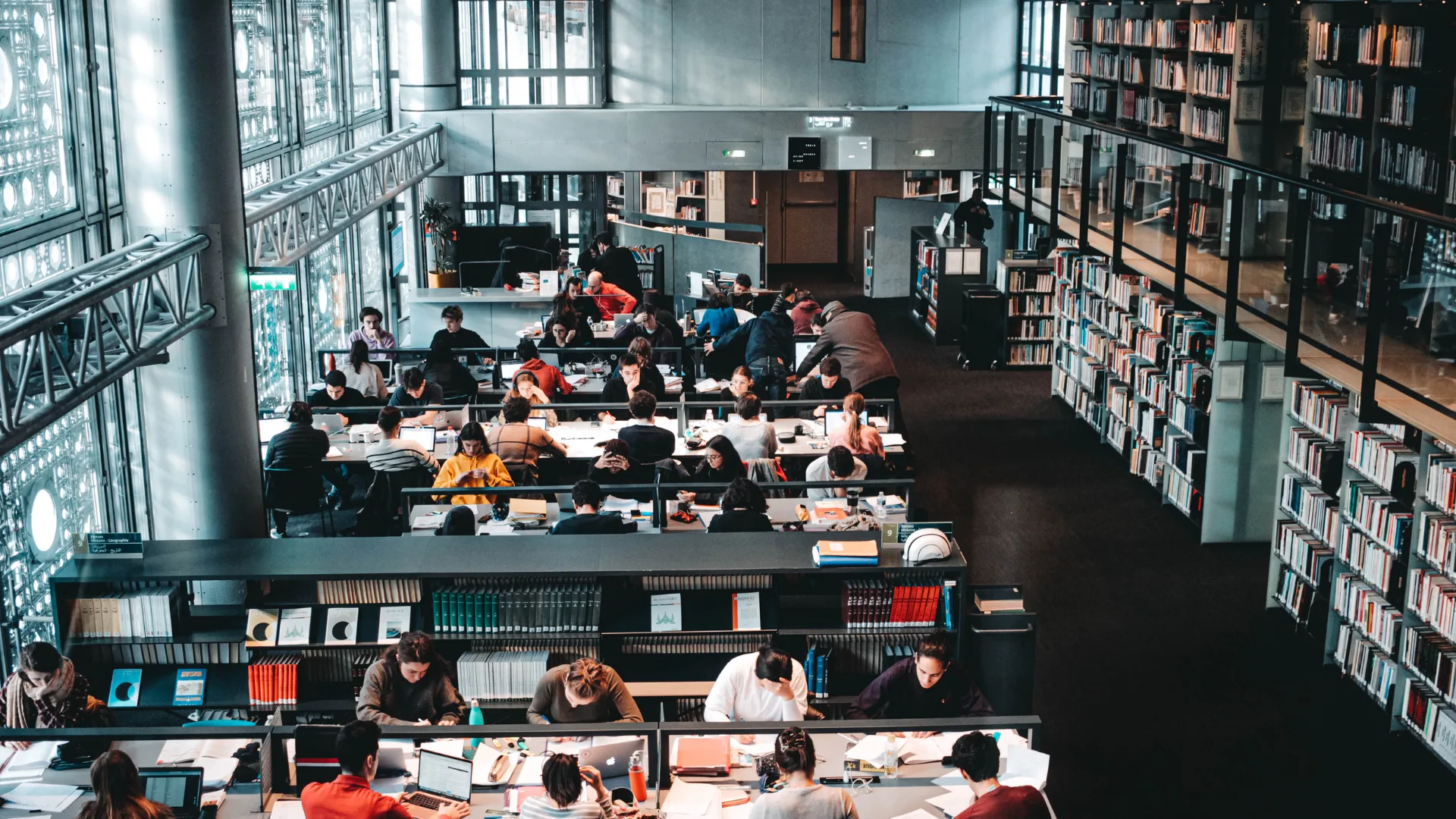 university or college library with a lot of students