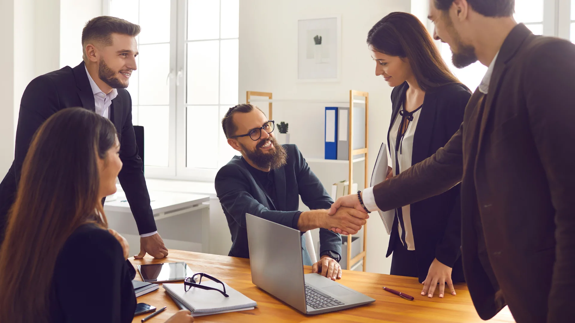 handshake and happy between business men and women